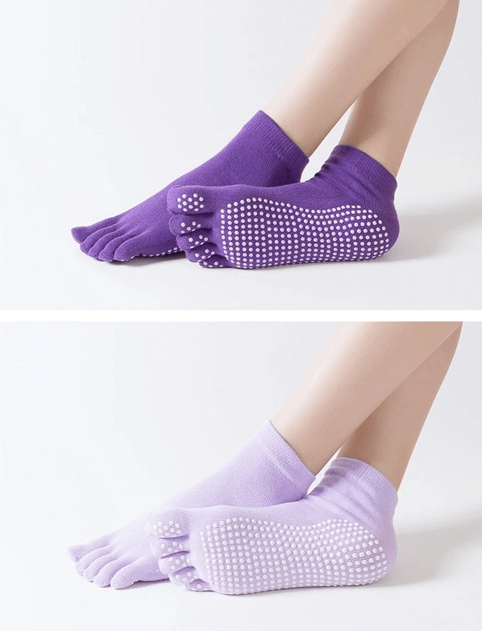 Purple non-slip five-toe socks for women, ideal for yoga and sports, showcasing grip soles and quick-dry material.